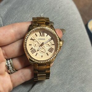 Rose gold fossil watch used with wear on band